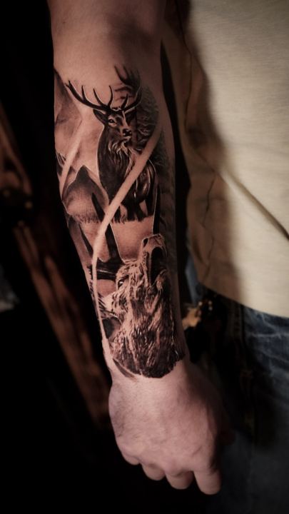 Black and grey realism stag tattoo on a forearm
