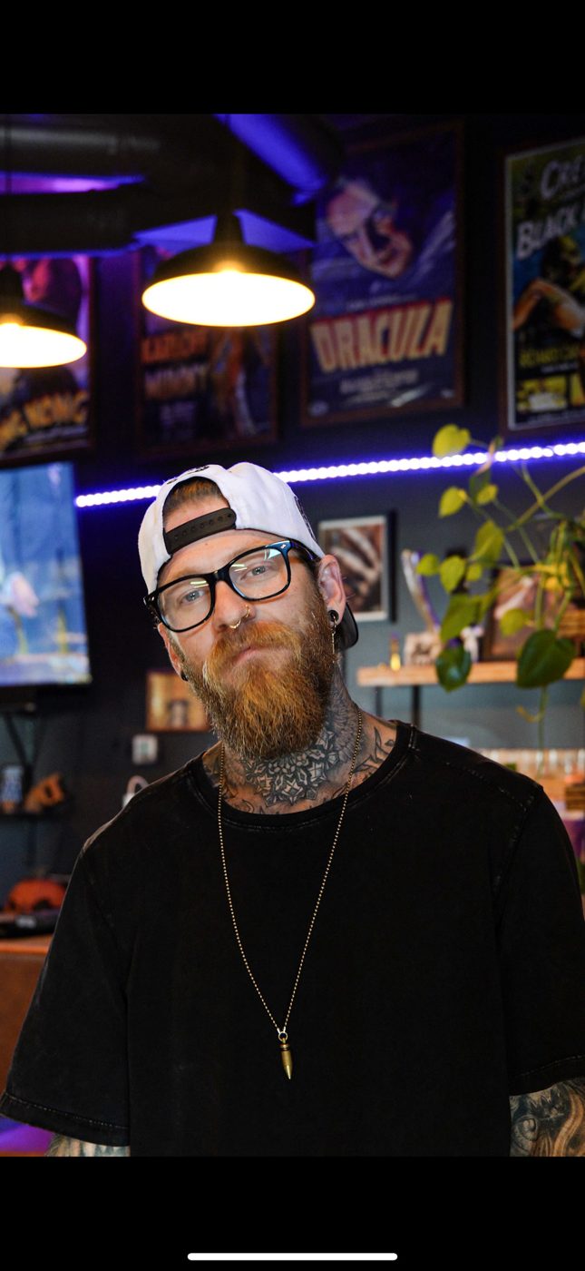 Dylan Payne, tattoo artist, in the studio