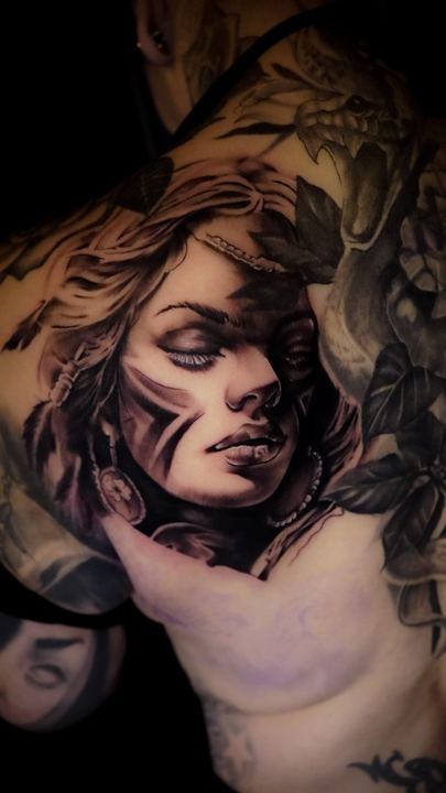 Black and grey realism portrait of a woman on the chest and shoulder
