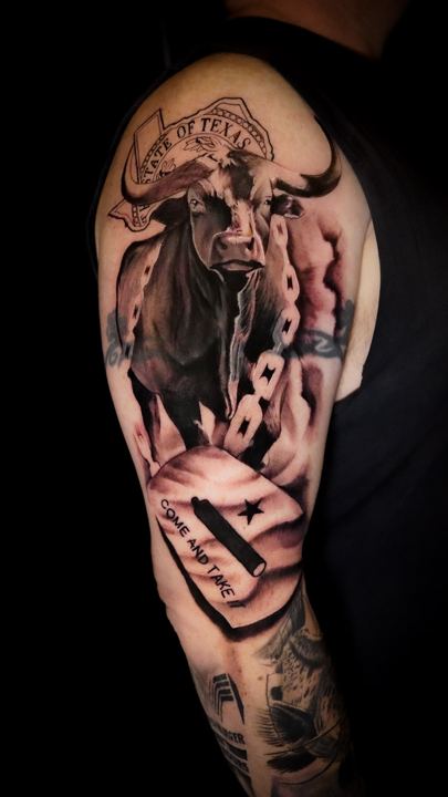 Black and grey realism bull tattoo on a shoulder