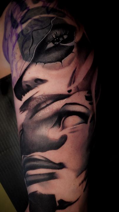 Black and grey realism portrait tattoo on a forearm