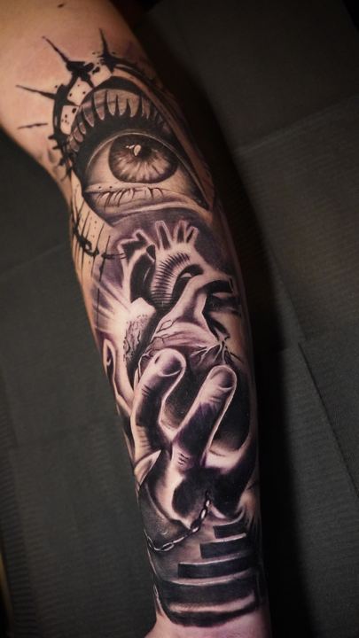 Black and grey realism eye tattoo on a forearm